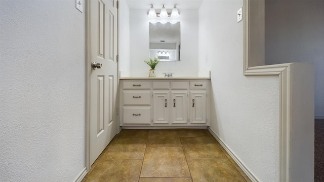 bathroom featuring vanity and tile patterned flooring