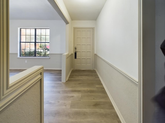 corridor featuring wood-type flooring