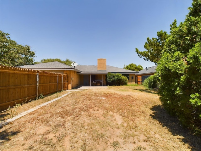 rear view of property with a patio area