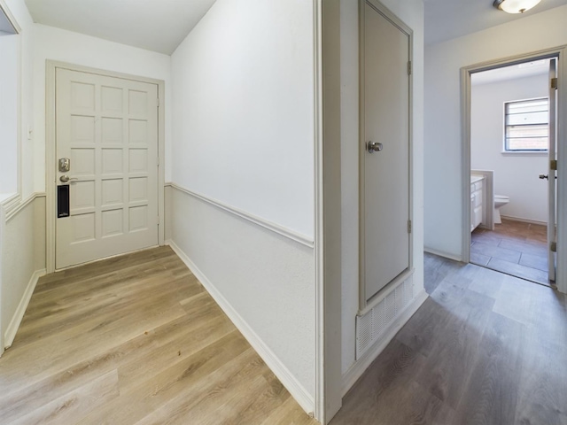 hallway featuring light hardwood / wood-style flooring