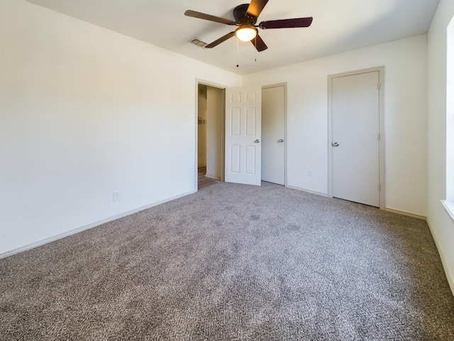 unfurnished bedroom featuring carpet and ceiling fan