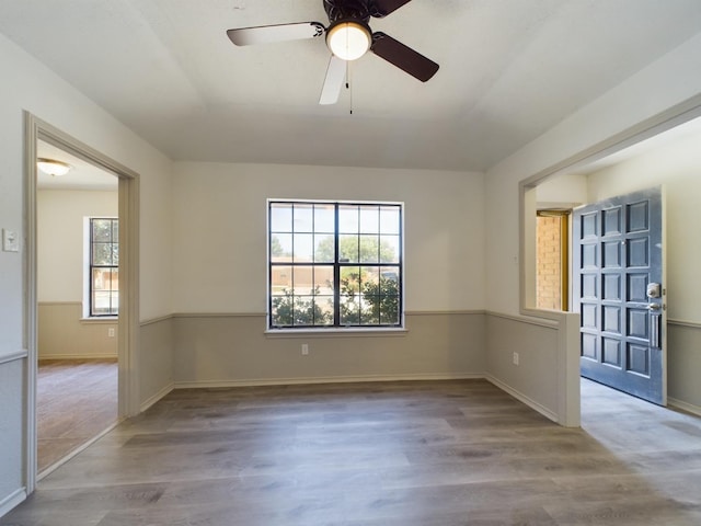 unfurnished room with light hardwood / wood-style flooring