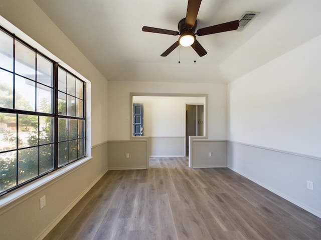 unfurnished room featuring ceiling fan and hardwood / wood-style floors