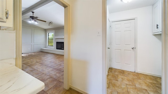 hall featuring lofted ceiling with beams