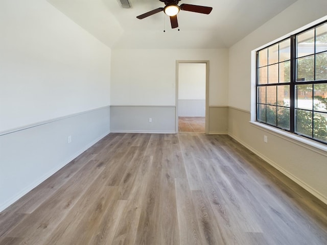 unfurnished room with ceiling fan and light hardwood / wood-style floors