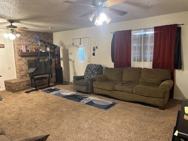 living room featuring ceiling fan, carpet, and a textured ceiling