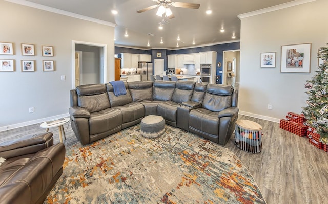 living room featuring crown molding, ceiling fan, and hardwood / wood-style floors