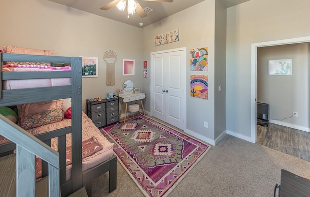 bedroom featuring carpet flooring, ceiling fan, and a closet