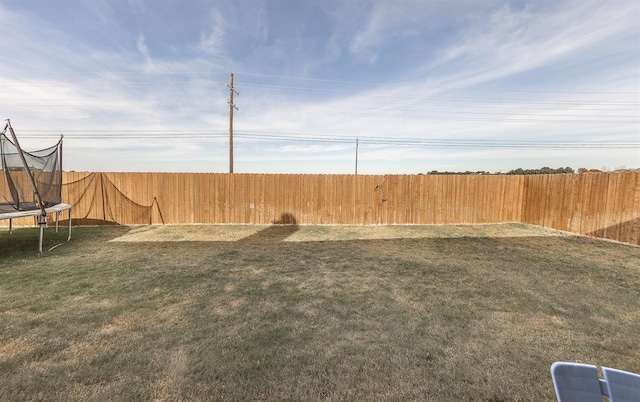 view of yard featuring a trampoline