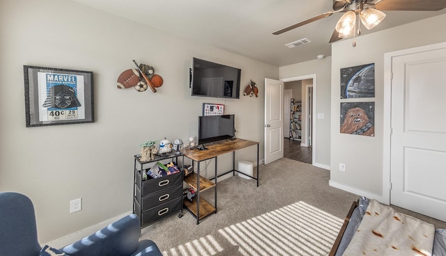 office space with light colored carpet and ceiling fan