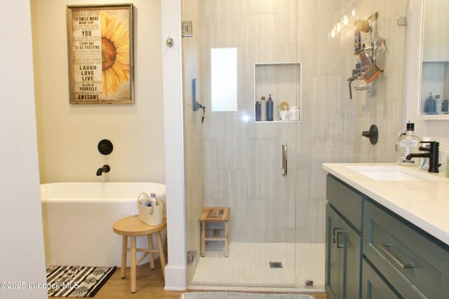1023 N Fulton Ave, Lubbock, TX 79416 - bathroom with a shower stall, vanity, and a freestanding tub