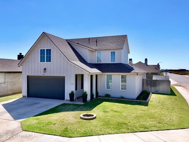 1023 N Fulton Ave, Lubbock, TX 79416 - view of front facade with an attached garage, driveway, board and batten siding, roof with shingles, and a fire pit