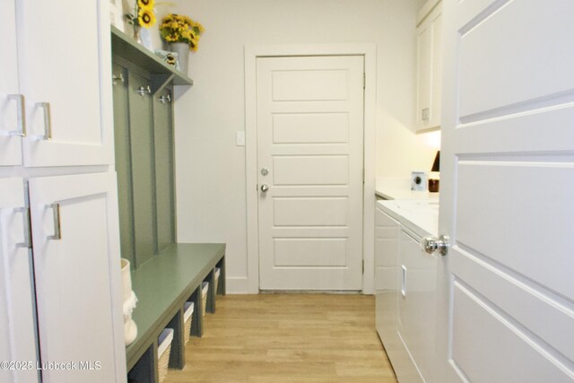 1023 N Fulton Ave, Lubbock, TX 79416 - mudroom featuring light wood finished floors and washer and dryer