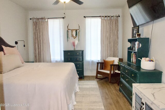 1023 N Fulton Ave, Lubbock, TX 79416 - bedroom featuring light wood-style floors, multiple windows, and ceiling fan