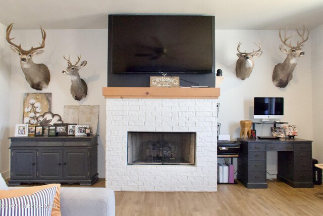 1023 N Fulton Ave, Lubbock, TX 79416 - living area featuring a fireplace and wood finished floors