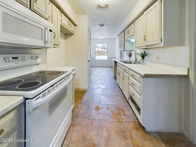3419 101st St, Lubbock, TX 79423 - kitchen with white appliances, light countertops, and backsplash