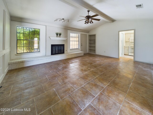 3419 101st St, Lubbock, TX 79423 - unfurnished living room with a ceiling fan, a fireplace, tile patterned flooring, and built in features