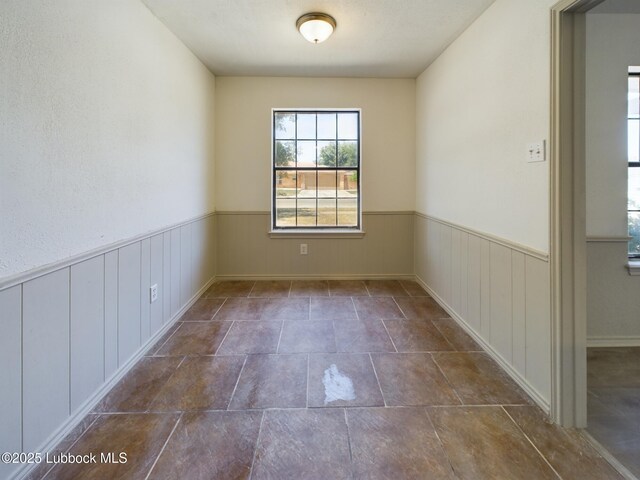 3419 101st St, Lubbock, TX 79423 - spare room featuring wainscoting