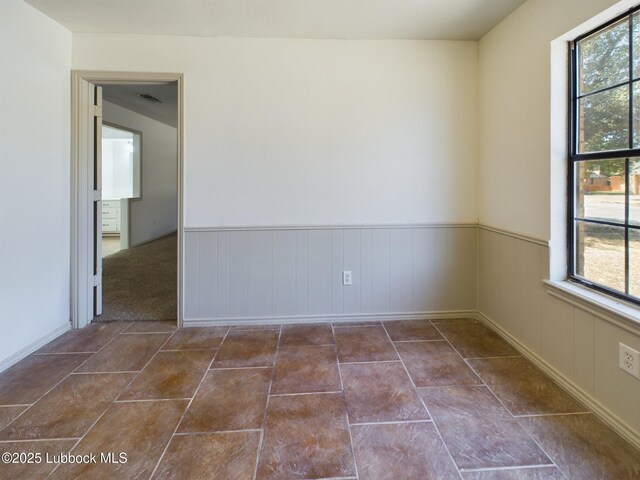 3419 101st St, Lubbock, TX 79423 - spare room with wainscoting