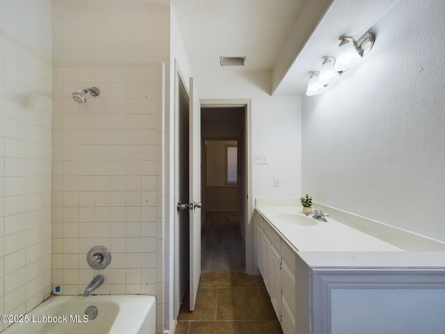 3419 101st St, Lubbock, TX 79423 - bathroom featuring vanity, shower / bath combination, and tile patterned flooring