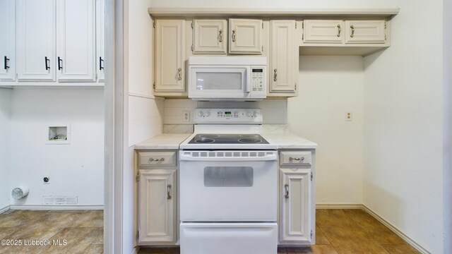 3419 101st St, Lubbock, TX 79423 - kitchen with white appliances, backsplash, and tile patterned floors