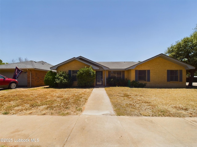 3419 101st St, Lubbock, TX 79423 - ranch-style home featuring brick siding and a garage