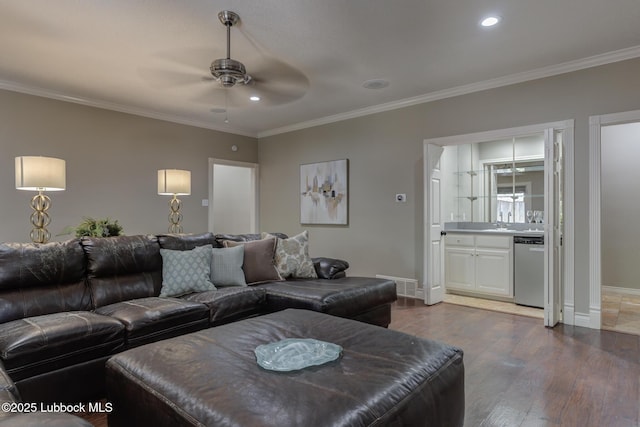 9406 Wayne Ave, Lubbock, TX 79424 - living area featuring ceiling fan, crown molding, dark wood-style floors, baseboards, and recessed lighting