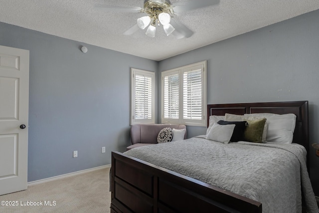 9406 Wayne Ave, Lubbock, TX 79424 - bedroom with light colored carpet, a textured ceiling, baseboards, and ceiling fan