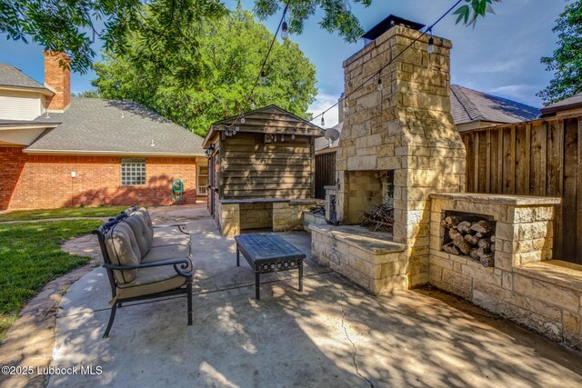 9406 Wayne Ave, Lubbock, TX 79424 - view of patio / terrace featuring an outdoor stone fireplace