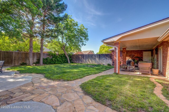 9406 Wayne Ave, Lubbock, TX 79424 - view of yard featuring a patio area