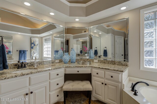9406 Wayne Ave, Lubbock, TX 79424 - bathroom with double vanity, ornamental molding, a bath, recessed lighting, and a shower