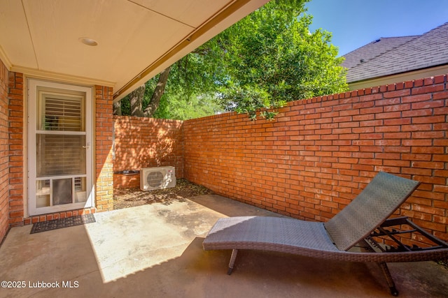 9406 Wayne Ave, Lubbock, TX 79424 - fenced backyard with ac unit and a patio area