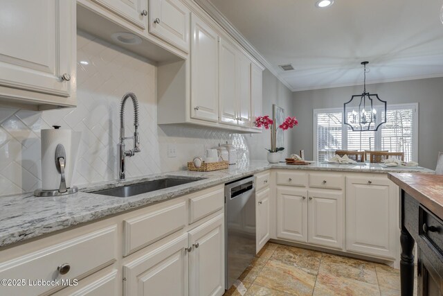 9406 Wayne Ave, Lubbock, TX 79424 - kitchen featuring dishwasher, a sink, backsplash, crown molding, and decorative light fixtures