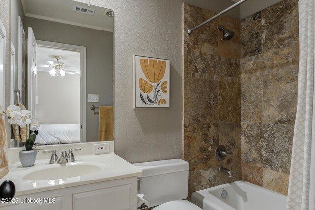 9406 Wayne Ave, Lubbock, TX 79424 - bathroom featuring shower / bath combo with shower curtain, vanity, toilet, a textured wall, and ceiling fan