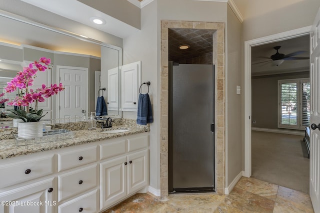 9406 Wayne Ave, Lubbock, TX 79424 - bathroom with crown molding, vanity, baseboards, a stall shower, and ceiling fan
