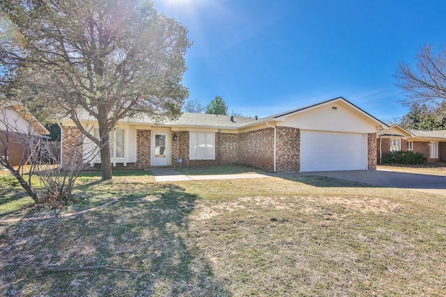 ranch-style home with a garage and a front lawn