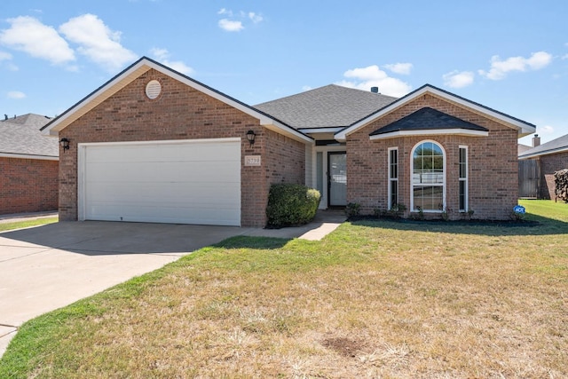 single story home featuring a garage and a front lawn