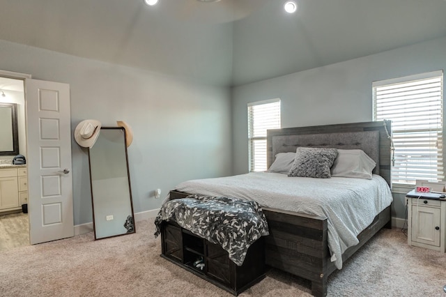 carpeted bedroom with vaulted ceiling