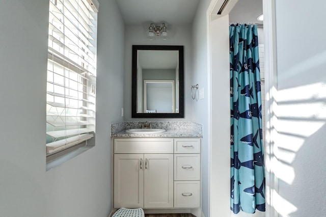 bathroom with vanity and a shower with shower curtain