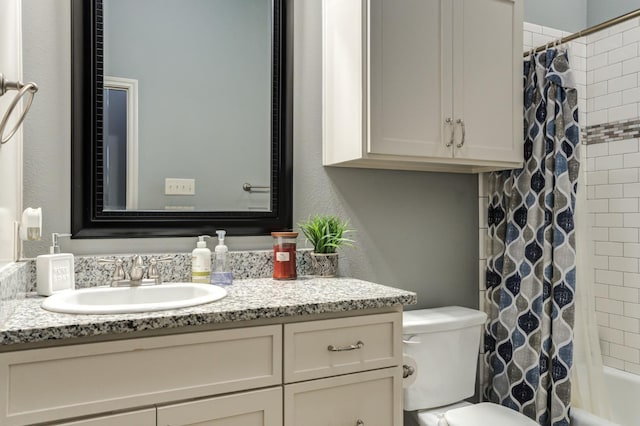 full bathroom featuring vanity, toilet, and shower / tub combo