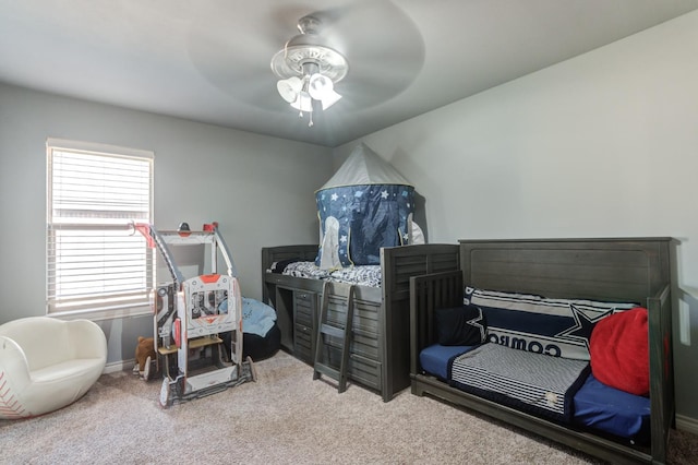 carpeted bedroom featuring ceiling fan