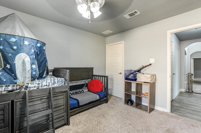 carpeted bedroom featuring ceiling fan