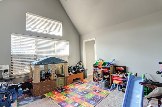 playroom featuring carpet flooring and vaulted ceiling