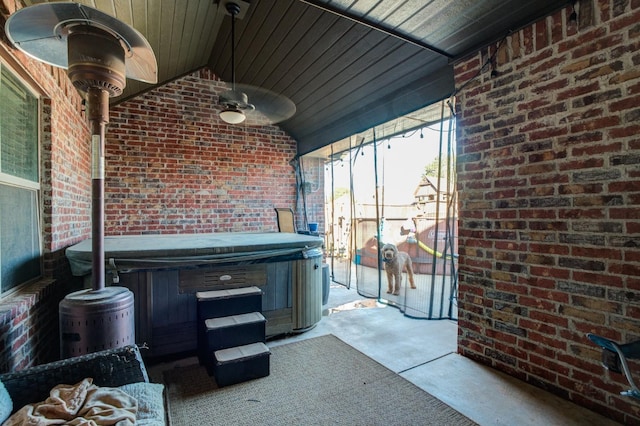 view of patio / terrace with a hot tub