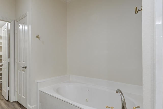 4107 101st St, Lubbock, TX 79423 - bathroom with a whirlpool tub and wood finished floors