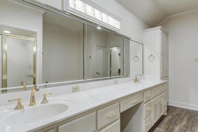 4107 101st St, Lubbock, TX 79423 - full bathroom featuring double vanity, wood finished floors, and a stall shower