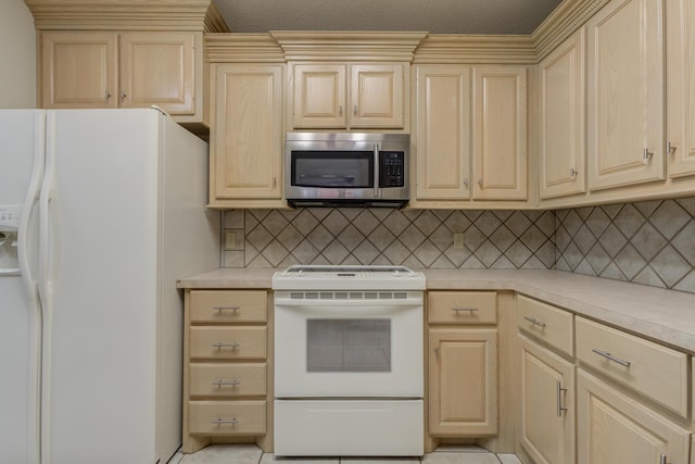 4107 101st St, Lubbock, TX 79423 - kitchen featuring white appliances, light countertops, tasteful backsplash, and cream cabinets