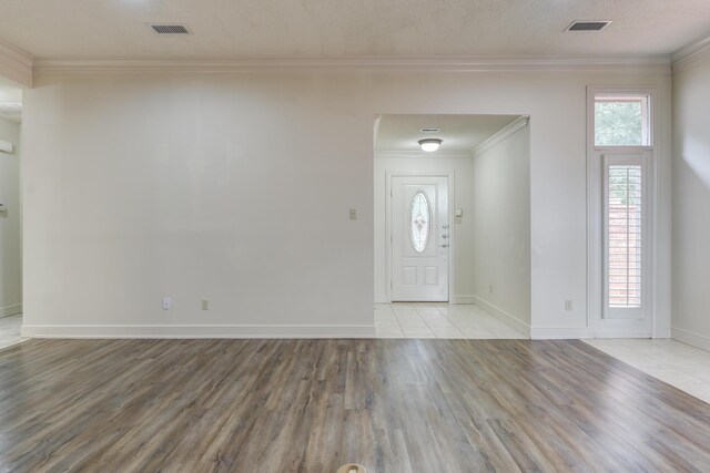 4107 101st St, Lubbock, TX 79423 - foyer with light wood-style flooring and ornamental molding