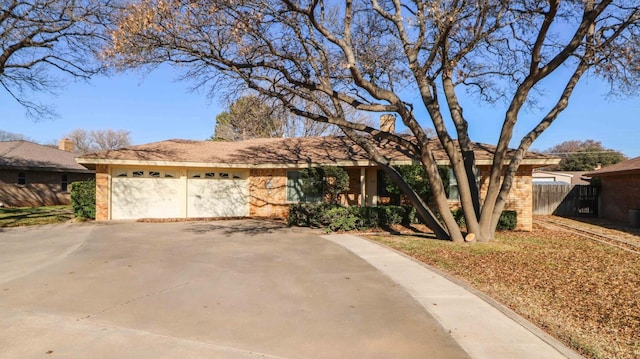 ranch-style house featuring a garage