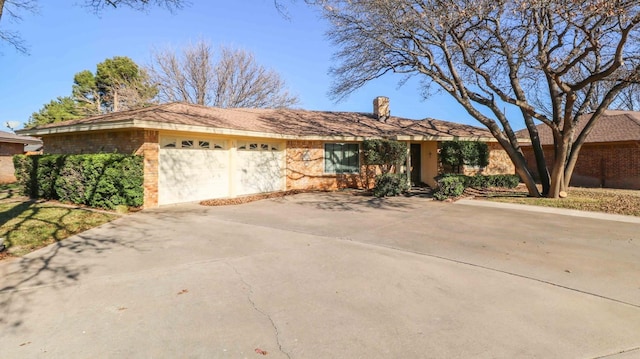 single story home with a garage